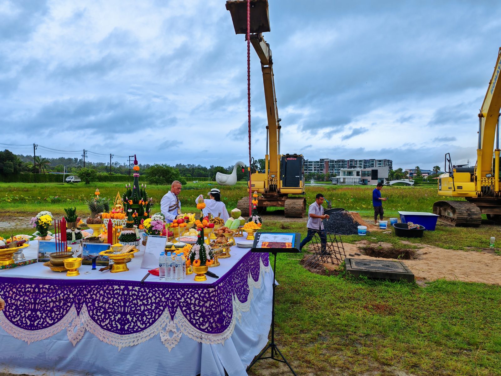 Royal Lee Turquoise, Phuket. Photo taken 2025-08-30. Groundbreaking ceremony on the cleared site with excavators positioned for earthworks.