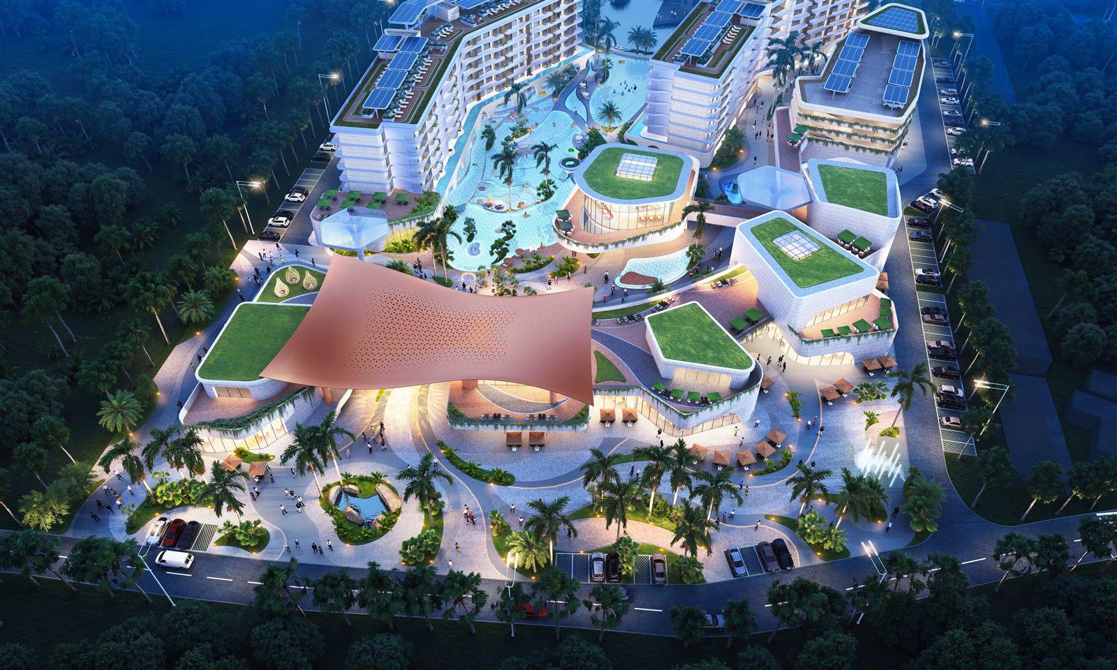 Dusk aerial of the development showing the mall, residences, lagoon swimming pools and rooftop solar panels